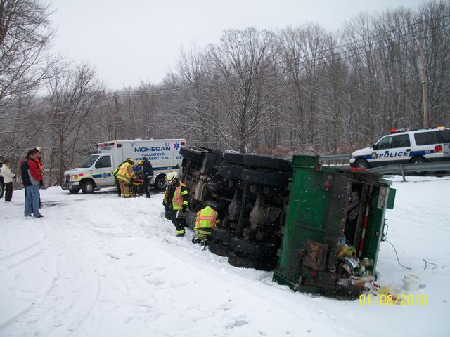 Firefighters Check For Possible Leaking Fluids On 1/8/10 At Truck Rollover